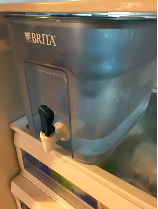 brita flow water tank filter on fridge shelf